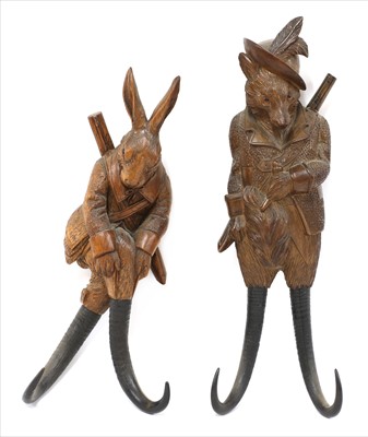 Lot 126 - Two Black Forest double wooden antler wall hooks