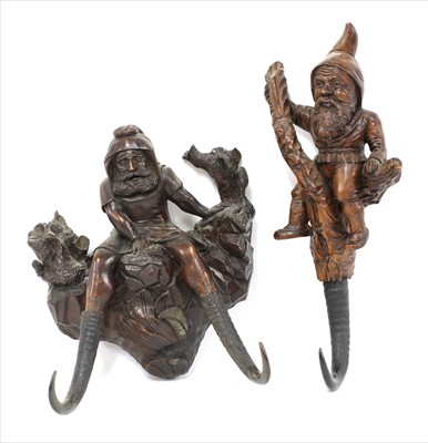 Lot 127 - Two Black Forest wooden wall hooks