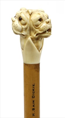 Lot 183 - A carved ivory triple bulldog's head walking stick