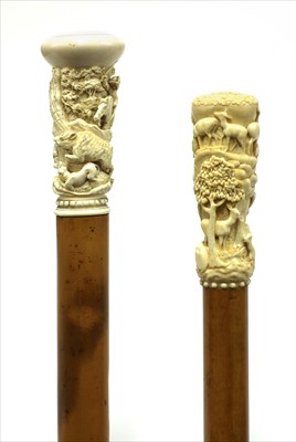 Lot 190 - Two carved ivory walking sticks