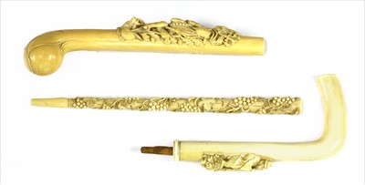 Lot 166 - Three carved ivory parasol or walking stick handles