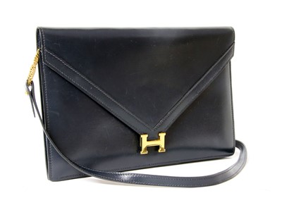 Lot 416 - An Hermès 'Lydie' blue clutch bag
