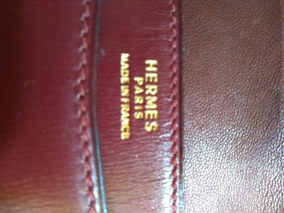 Lot 417 - An Hermès 'Lydie' red clutch bag