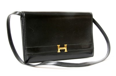 Lot 415 - An Hermès vintage black 'Annie' clutch bag
