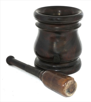 Lot 55 - A lignum vitae pestle and mortar
