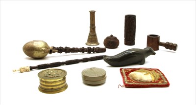 Lot 110 - A carved South-East Asian pipe