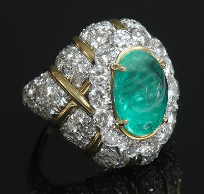 Lot 140 - An
emerald and diamond bombé form ring by David Webb