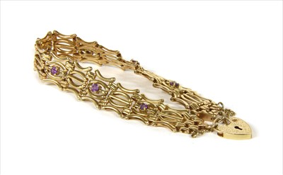 Lot 13 - A 9ct gold amethyst five row gate bracelet
