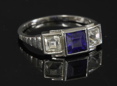 Lot 123 - An Austrian Art Deco three stone synthetic sapphire and diamond ring
