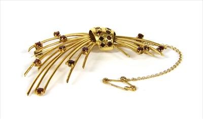 Lot 48 - A gold garnet spray brooch