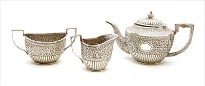Lot 140 - An Indian white metal three piece tea set