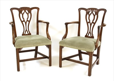 Lot 421 - A pair of George III style mahogany elbow chairs