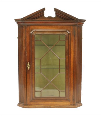 Lot 452 - An 18th century walnut hanging corner cupboard