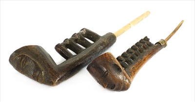 Lot 185 - Two Naga pipes