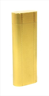 Lot 215 - A gold plated Cartier cigarette lighter