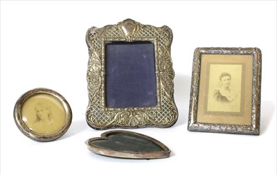 Lot 63 - Four silver easel back photograph frames
