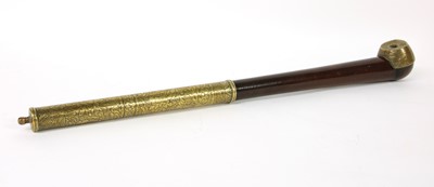 Lot 67 - A Chinese wood and brass-mounted opium pipe