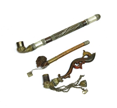 Lot 14 - Three Persian pipes