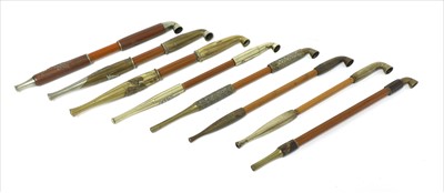 Lot 21 - A collection of eight Japanese kiseru tobacco pipes