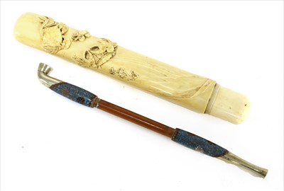 Lot 36 - A Japanese ivory kiseruzutsu with kiseru
