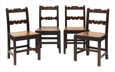 Lot 799 - An harlequin set of four oak solid seat chairs