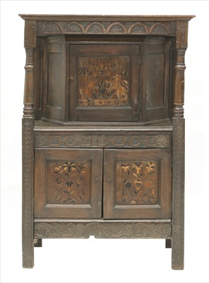 Lot 877 - An oak court cupboard