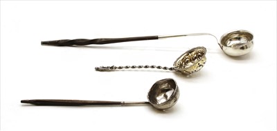 Lot 59 - A silver strainer having figural terminal