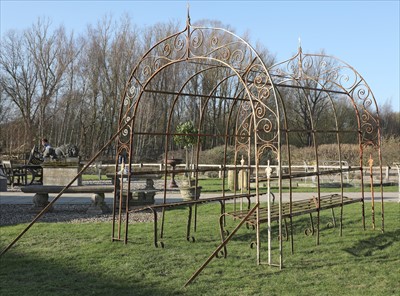 Lot 977 - A wrought iron arbour