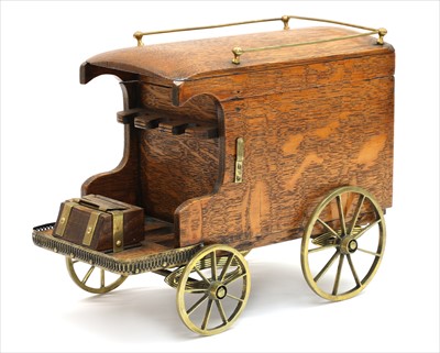 Lot 89 - An oak smoker's companion