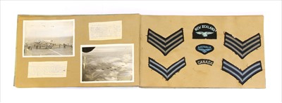 Lot 152 - A World War II photograph album/scrapbook