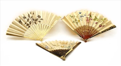 Lot 99 - An Edwardian black and red lacquer fan