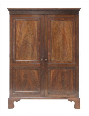 Lot 850 - A George III mahogany and crossbanded wardrobe