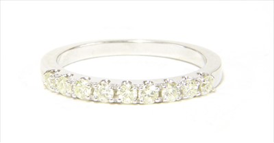 Lot 24 - A 9ct white gold half eternity ring
