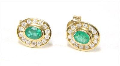 Lot 37 - A pair of 9ct gold emerald and diamond cluster earrings