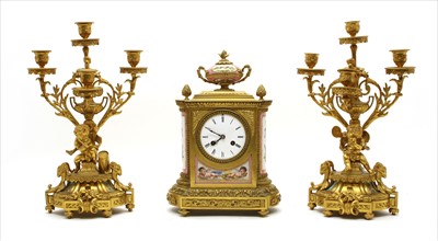 Lot 410 - A matched French gilt bronze clock garniture
