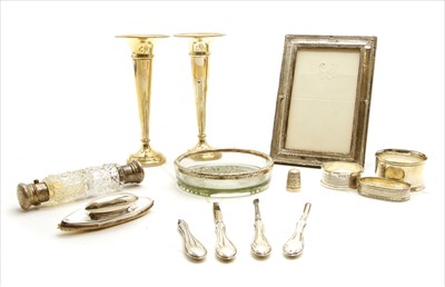 Lot 104 - A pair of silver bud vases