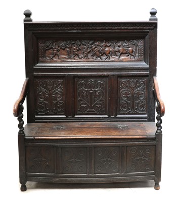 Lot 855 - A Victorian carved oak settle