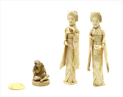 Lot 124 - Two Japanese carved ivory female figures