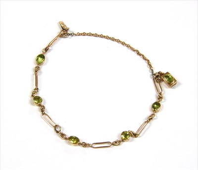 Lot 6 - A gold peridot bracelet