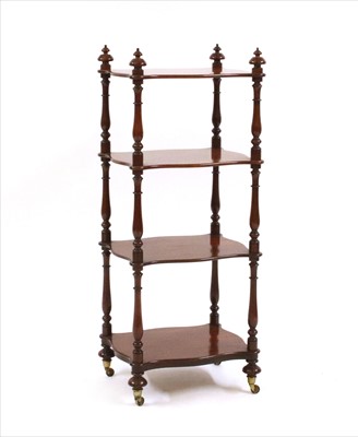 Lot 599 - A William IV four tier mahogany serpentine what-not