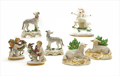 Lot 231 - A pair of Continental porcelain lamb figures