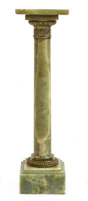 Lot 495 - An onyx and gilt-mounted column