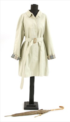 Lot 1097 - A Burberry mackintosh and umbrella