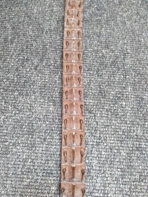 Lot 1141 - A Pickett of London gentleman's brown hornback crocodile belt