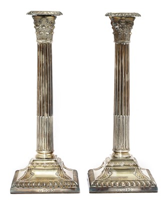 Lot 62 - A pair of Victorian silver Corinthian column candlesticks