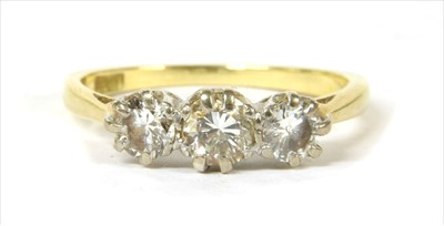 Lot 80 - A gold three stone diamond ring
