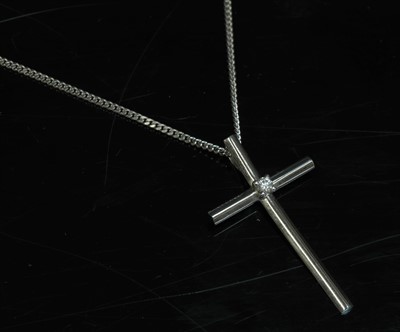 Lot 300 - An 18ct white gold diamond set Latin form cross