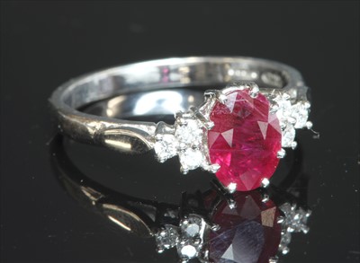 Lot 250 - An 18ct white gold ruby and diamond seven stone ring