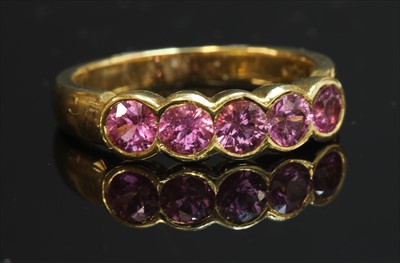 Lot 218 - An 18ct gold five stone pink sapphire ring