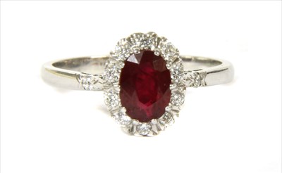 Lot 49 - An 18ct gold ruby and diamond cluster ring